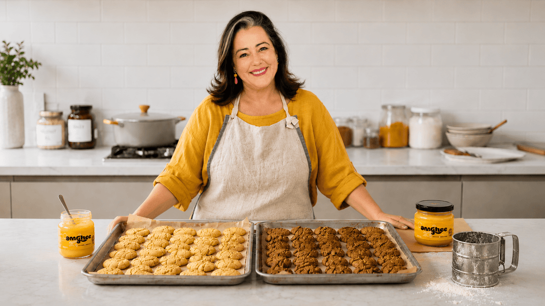 Ghee Maker standing behind kitchen bench with cookies made with ghee.