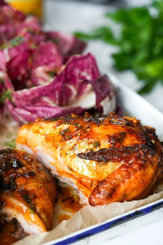 Butterfiled Roast Chicken Wing with salad in background