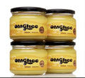 Four jars of OMGhee certified organic grass-fed ghee on a white background